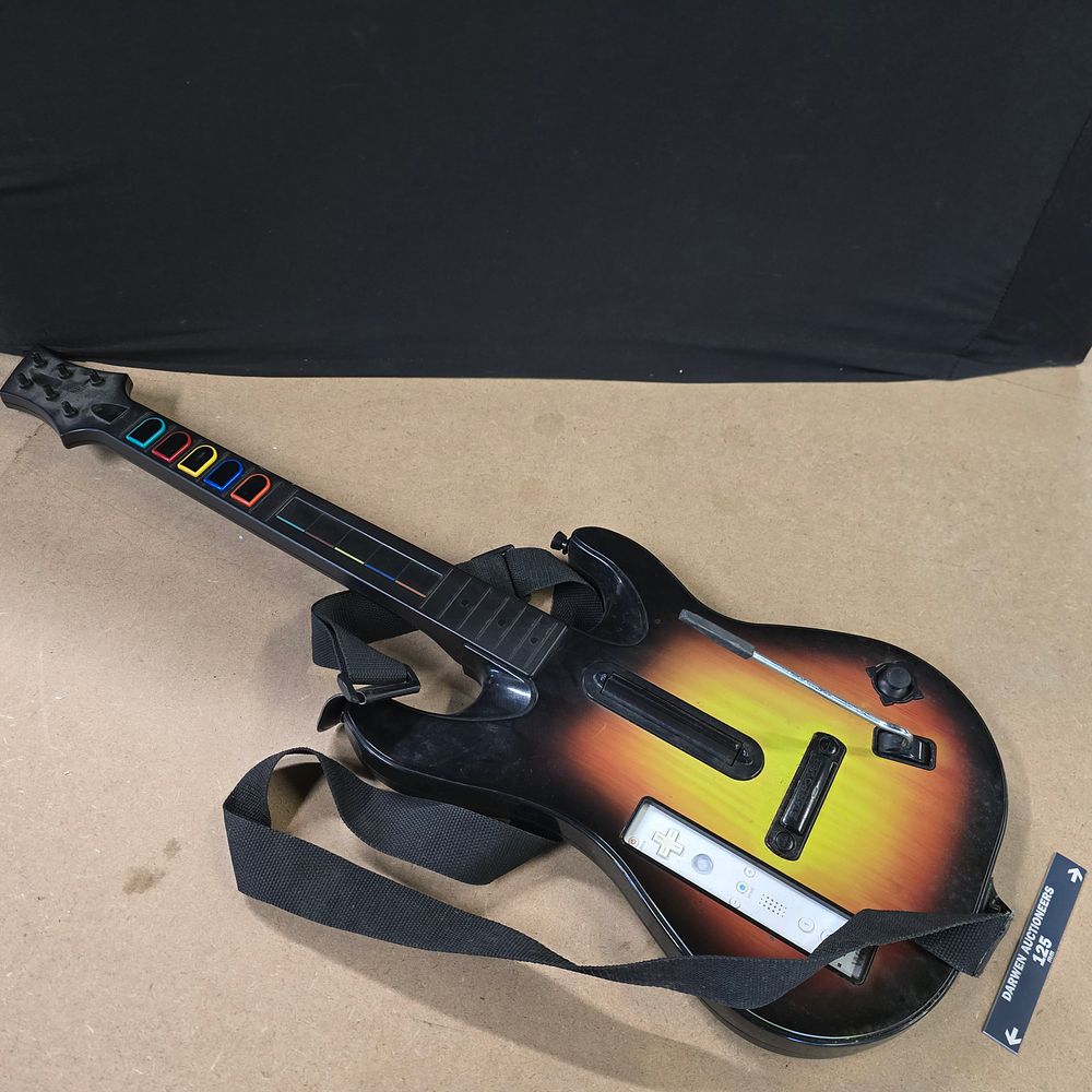 Lot 233: Red Octane Guitar Hero Wireless Guitar Controller for Nintendo Wii, Sunburst Finish, circa 2008