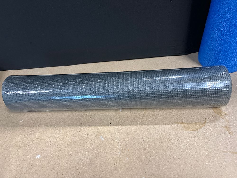 Lot 276: A Rolled Grey Textured Yoga Mat