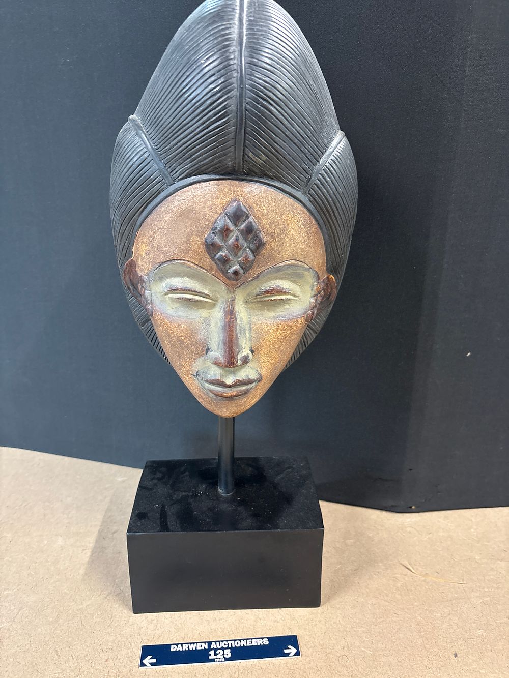 Lot 278: A Modern Resin Punu Style Oriental Bust on Gallery Stand, Late 20th Century