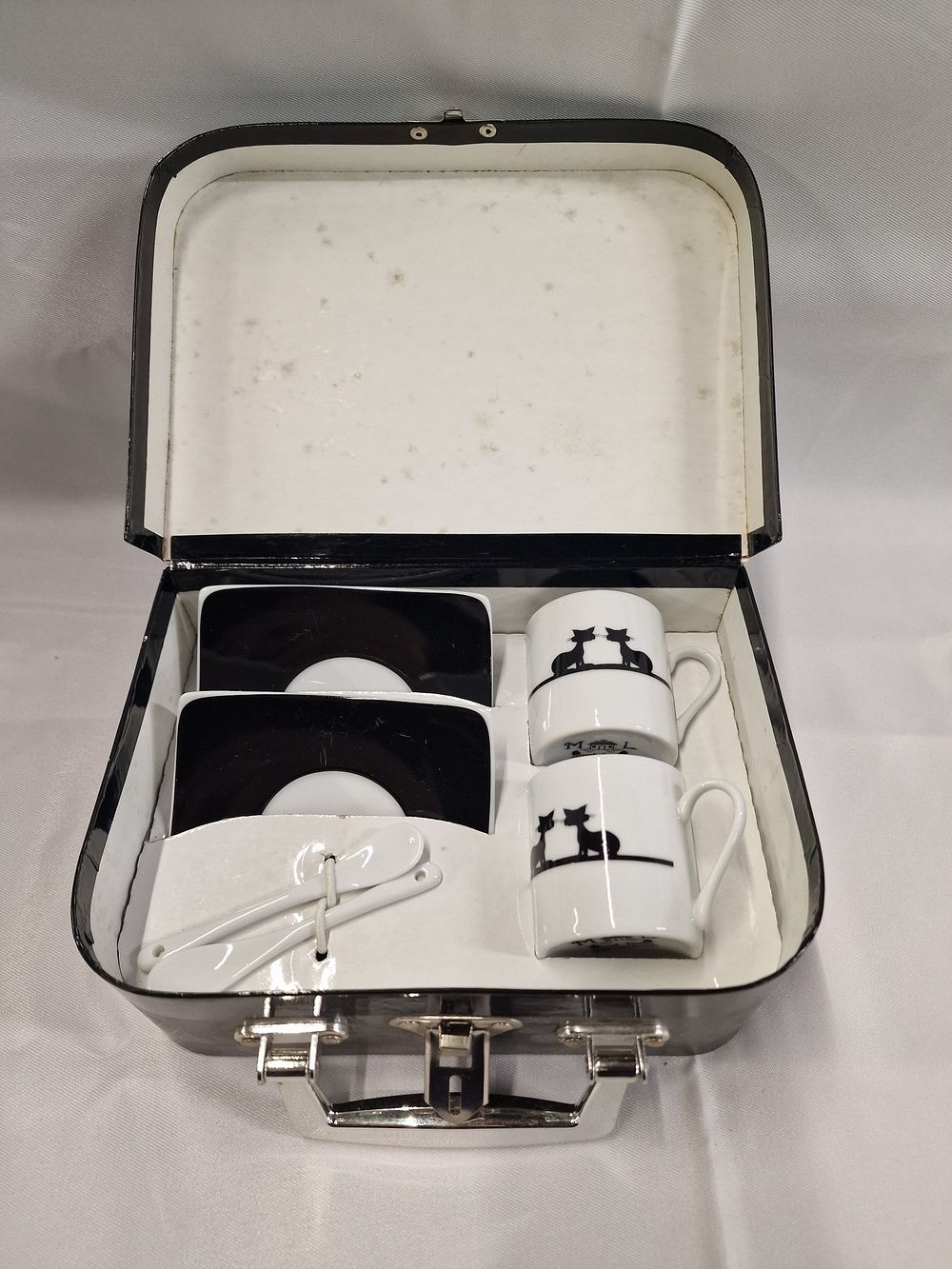 Lot 297: Miniature Ceramic Beverage Set in Fitted Travel Case, Contemporary, Cat Silhouette Decoration