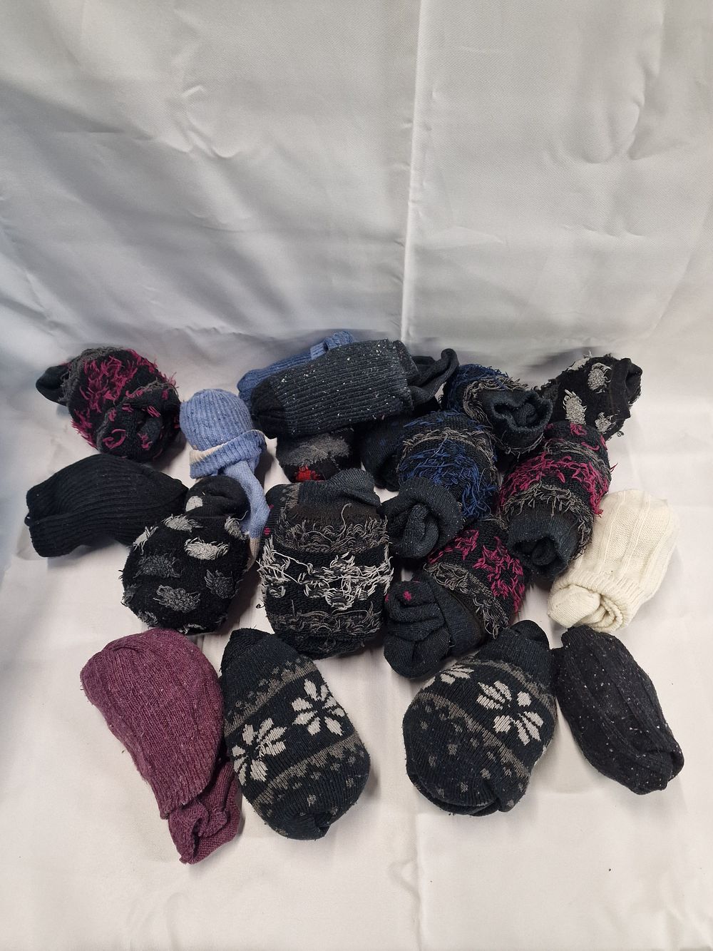 Lot 304: A collection of assorted winter knit beanies and thermal headwear