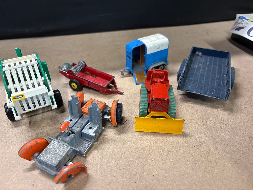 Lot 290: Britains Ltd and Matchbox, A Collection of Vintage Metal Agricultural Equipment and Construction Toys, mid-20th Century.