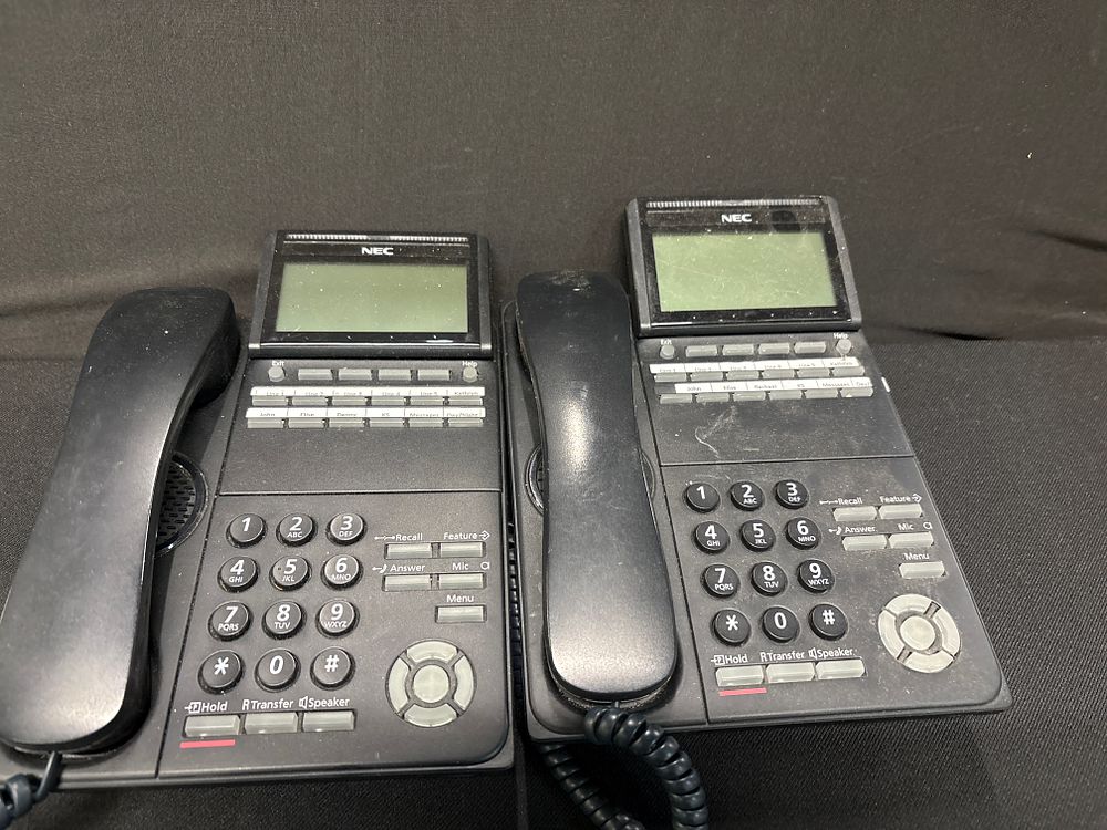 Lot 324: A Pair of NEC ITL-12D-1 DT700 Series 12-Button IP Display Desk Phones, Early 21st Century