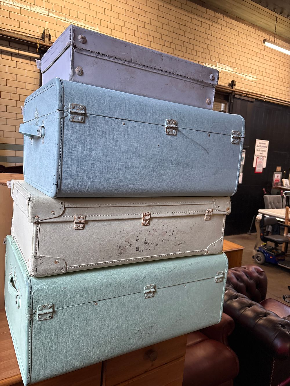 Lot 326: A Set of Four Mid-20th Century Style Pastel Painted Display Suitcases