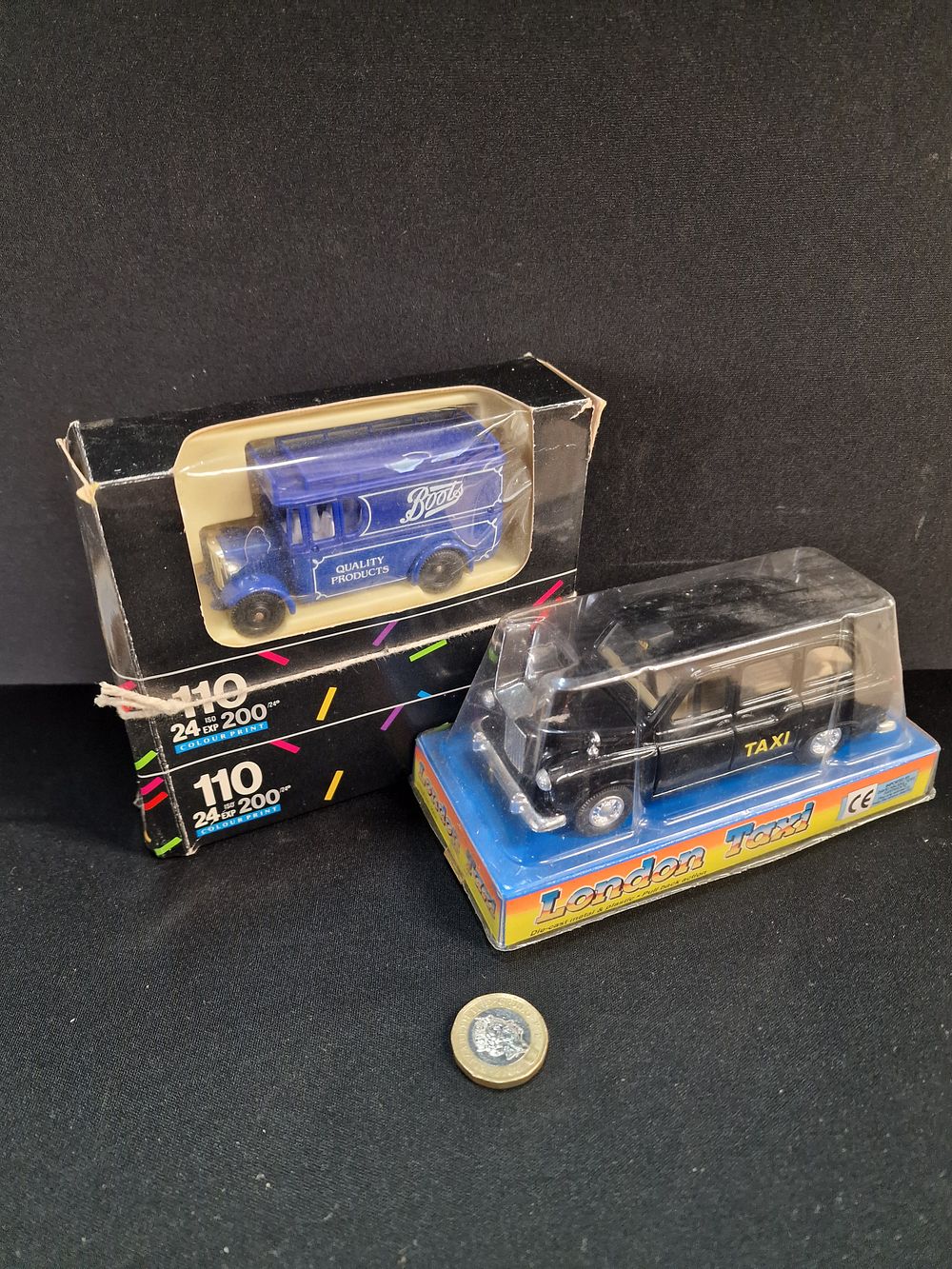 Lot 373: A Pair of Boxed Die-Cast Model Vehicles, London Taxi and Boots Van, Late 20th Century