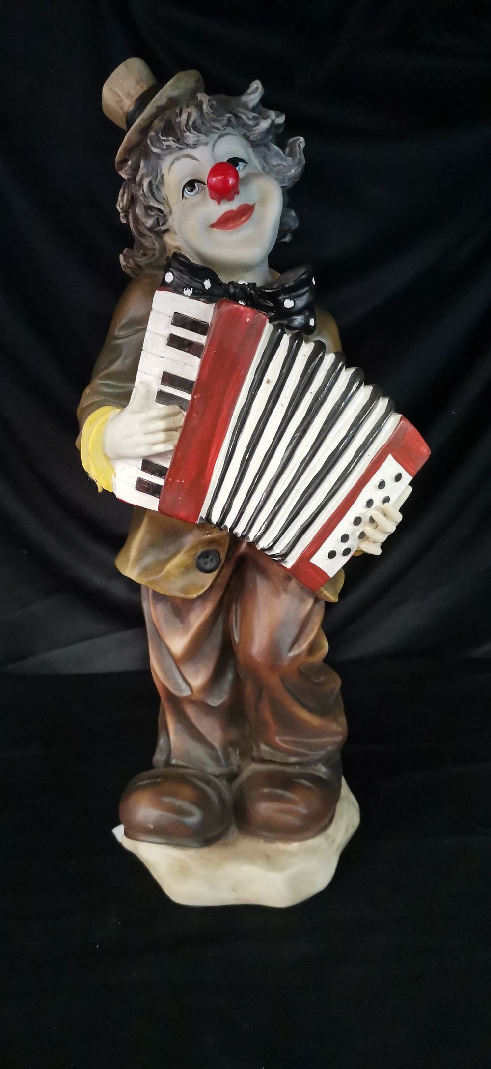 Lot 173: Clown Figurine Playing Accordion