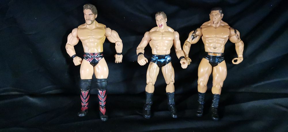 Lot 215: A Trio of Articulated Professional Wrestling Action Figures