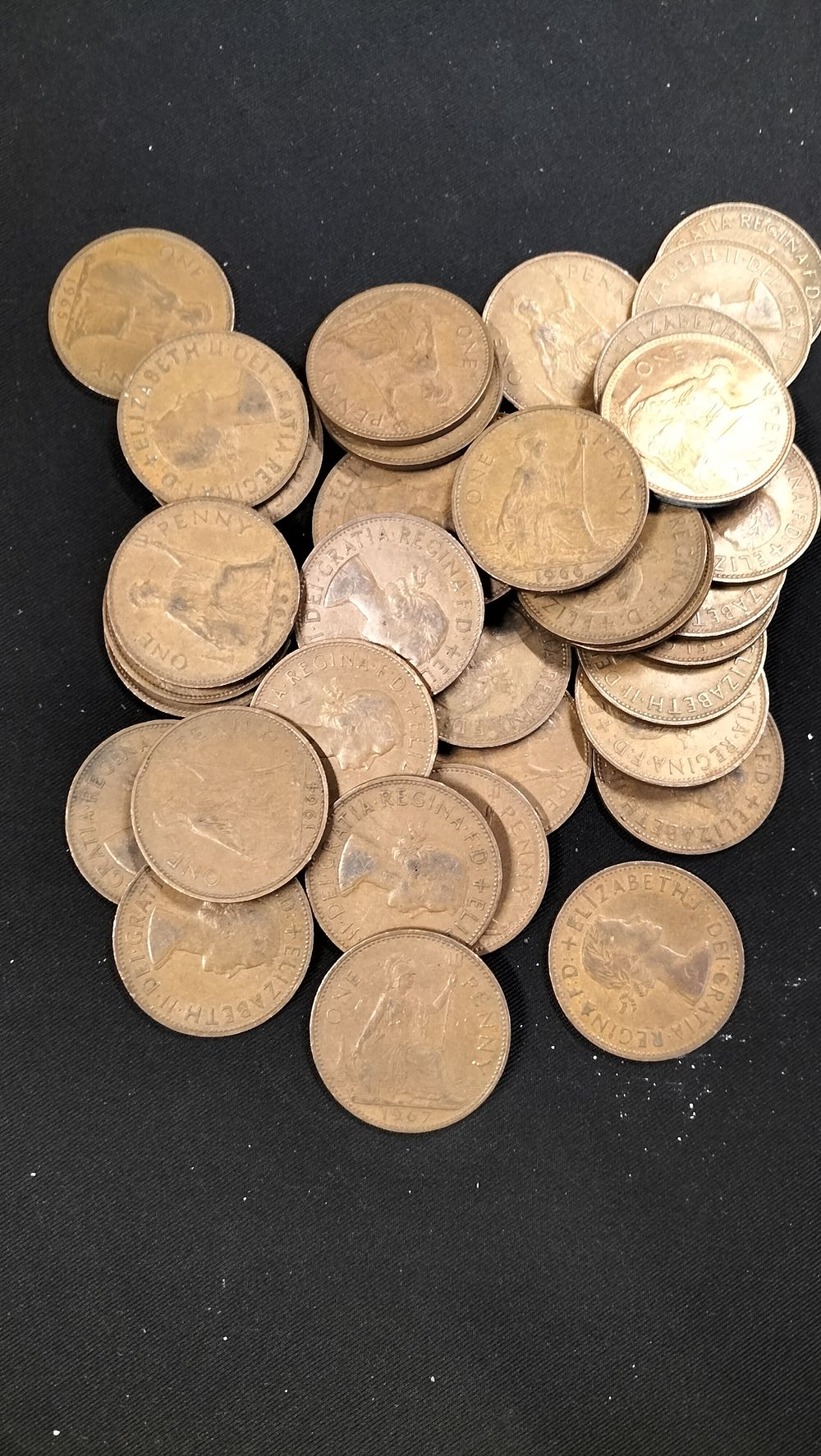Lot 411: 30 Queen Elizabeth II British One Penny Coins