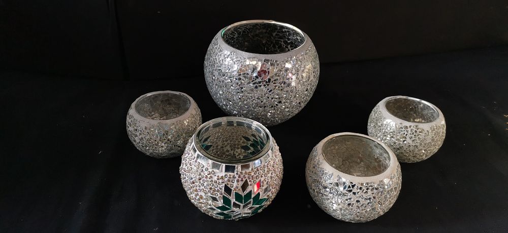 Lot 428: A Collection of Silver and White Mosaic Glass Candle Holders