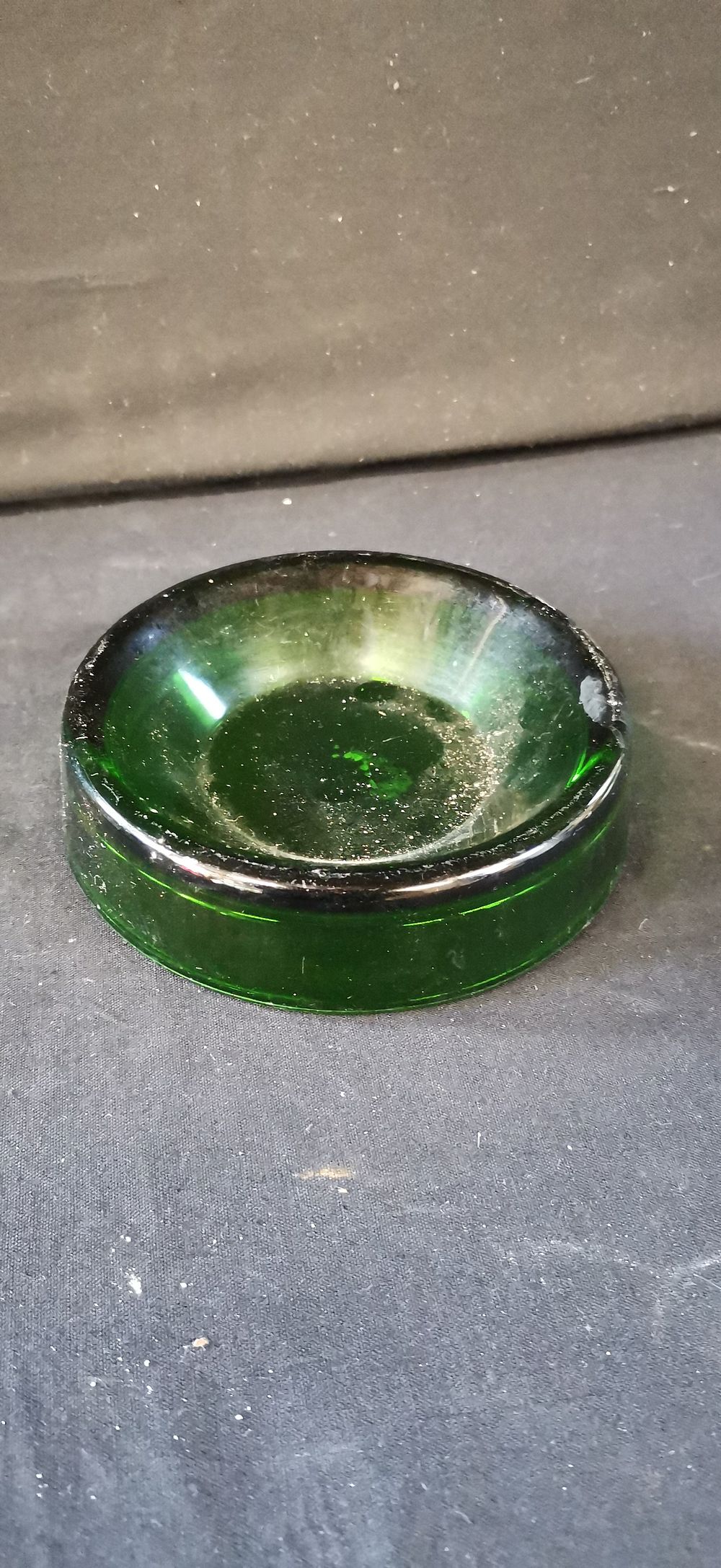 Lot 471: A Small Circular Dark Green Glass Dish