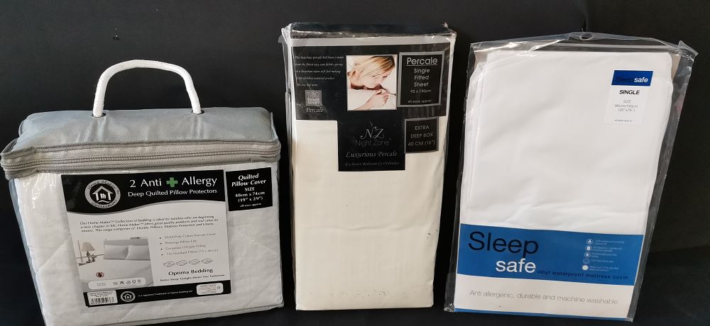 Lot 472: A Trio of White Bedding Items in Original Packaging