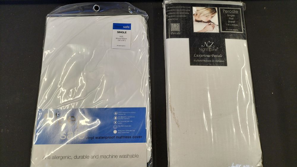 Lot 518: Two Single Bedding Items Including Mattress Cover and Flat Sheet