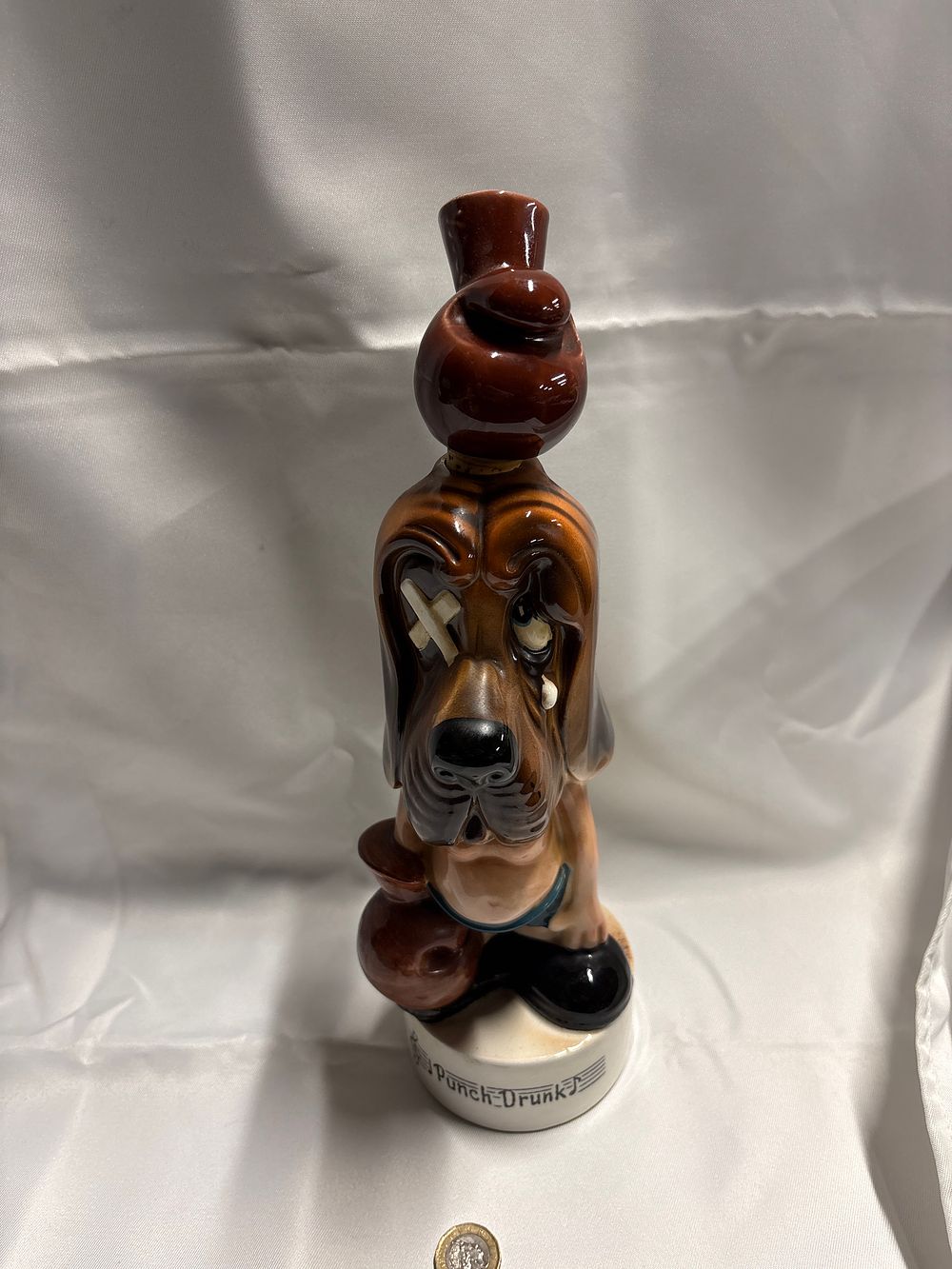Lot 228: A mid-20th-century Bond Ware style musical ceramic decanter titled Punch-Drunk