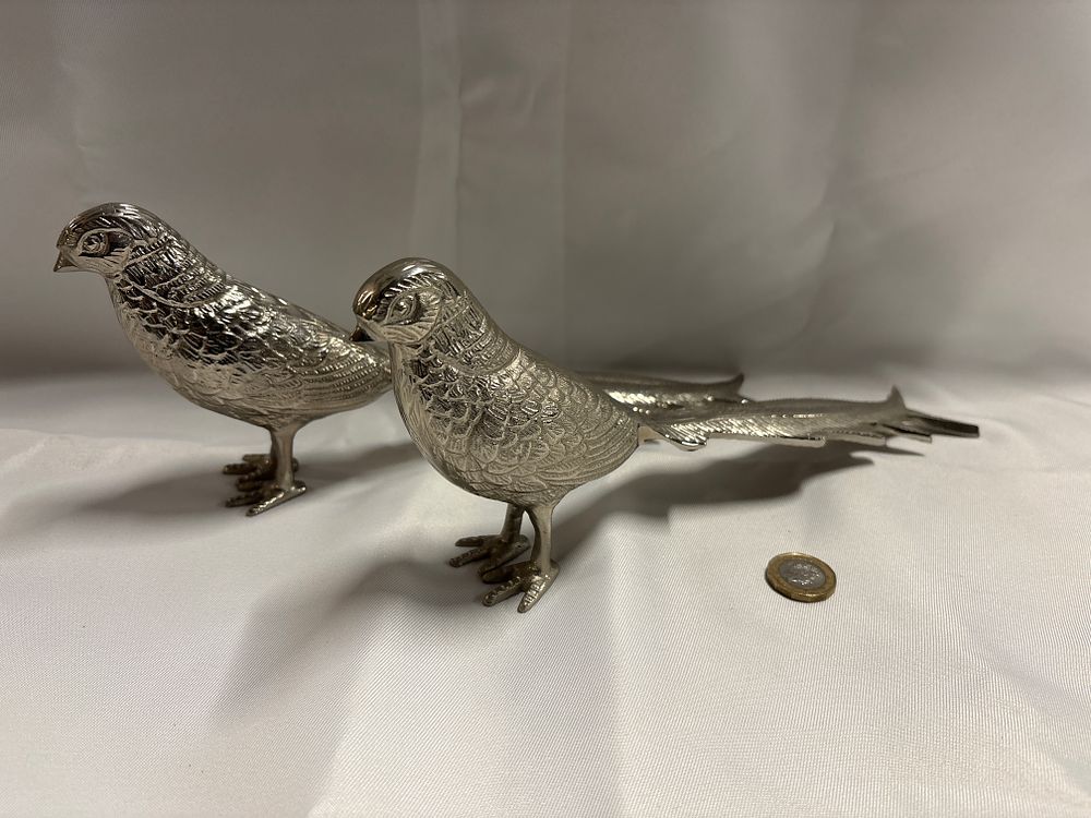 Lot 234: A Pair of Cast White Metal Pheasant Table Ornaments in the German Style