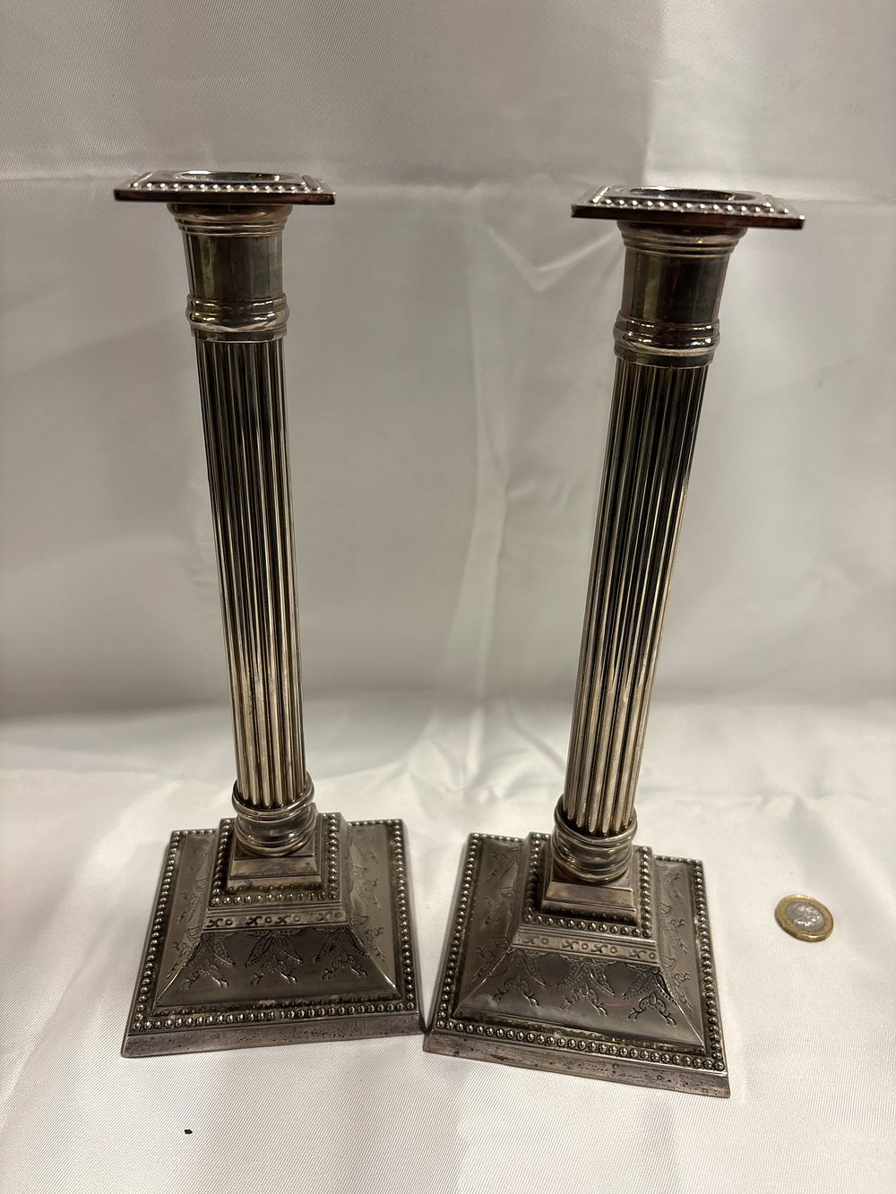 Lot 235: A Pair of Silver-Plated Corinthian Column Candlesticks
