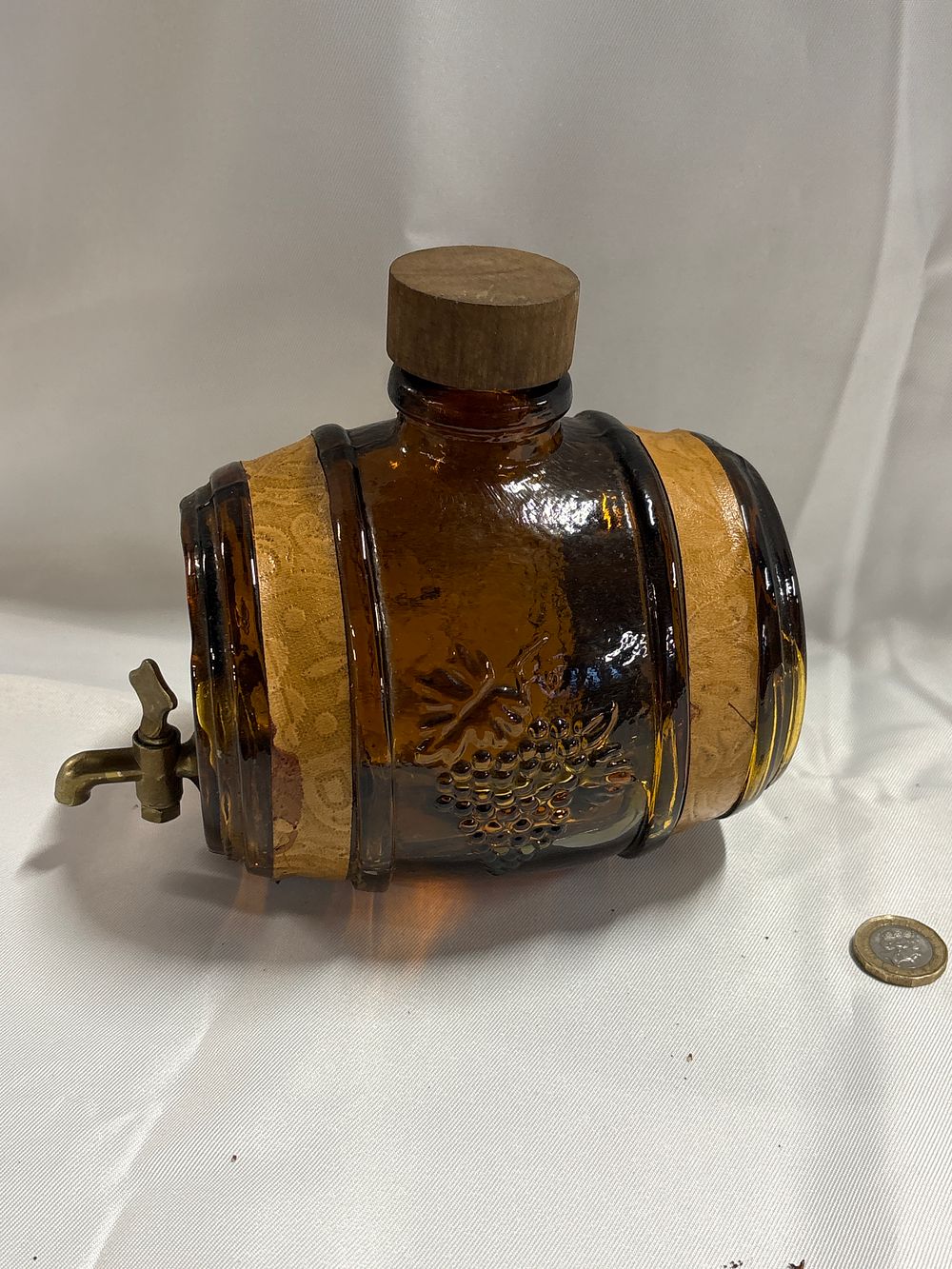 Lot 243: An Avon Amber Glass Barrel-Form Aftershave Dispenser