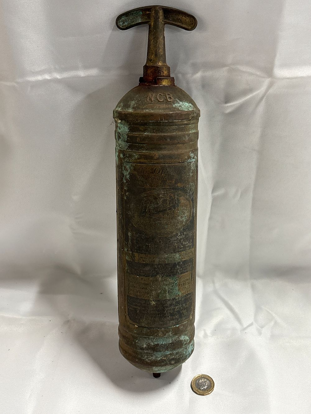 Lot 245: A Vintage Pyrene Metalic Pump Action Fire Extinguisher with NCB Markings