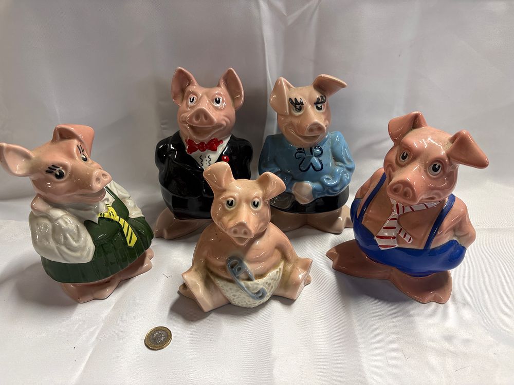 Lot 250: A Set of Five Wade NatWest Porcelain Piggy Banks