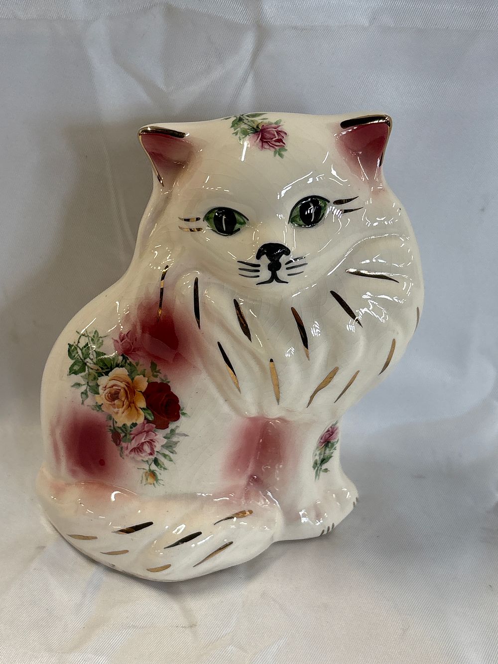 Lot 274: English Porcelain Seated Cat Figurine with Floral Decoration and Gilt Accents