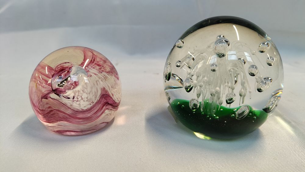 Lot 341: Two Art Glass Paperweights including Caithness Unicorn and a Green Controlled Bubble Example