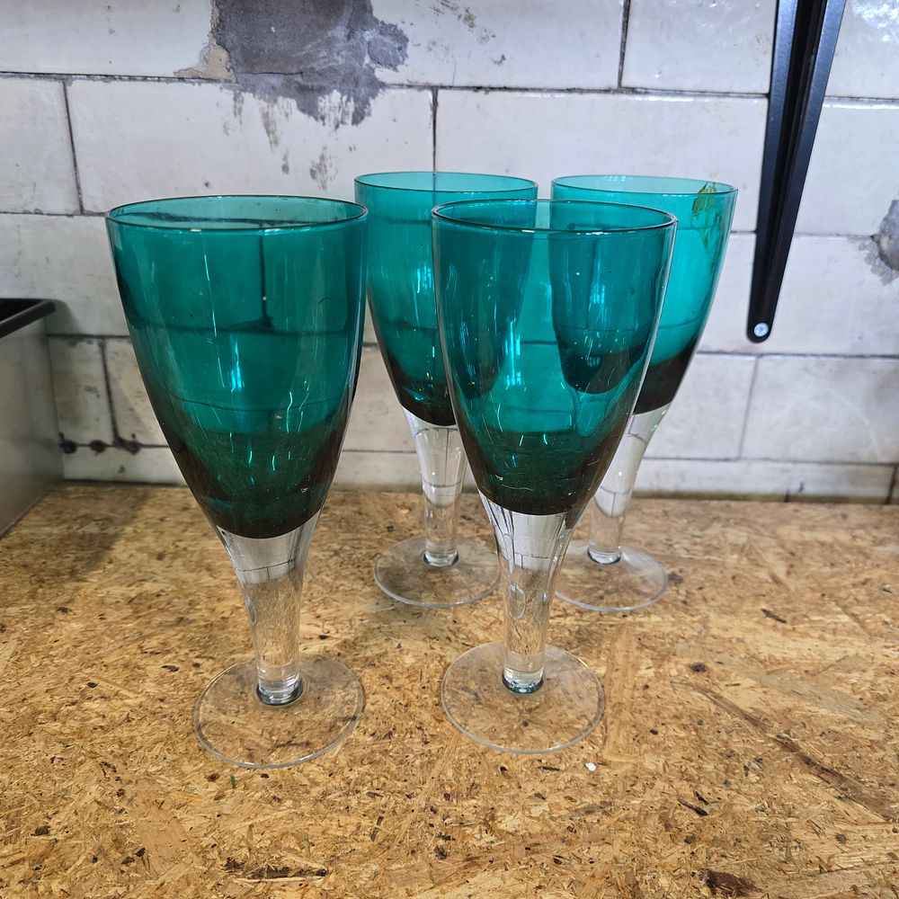 Lot 320: A Set of Four Contemporary Teal and Clear Glass Wine Goblets
