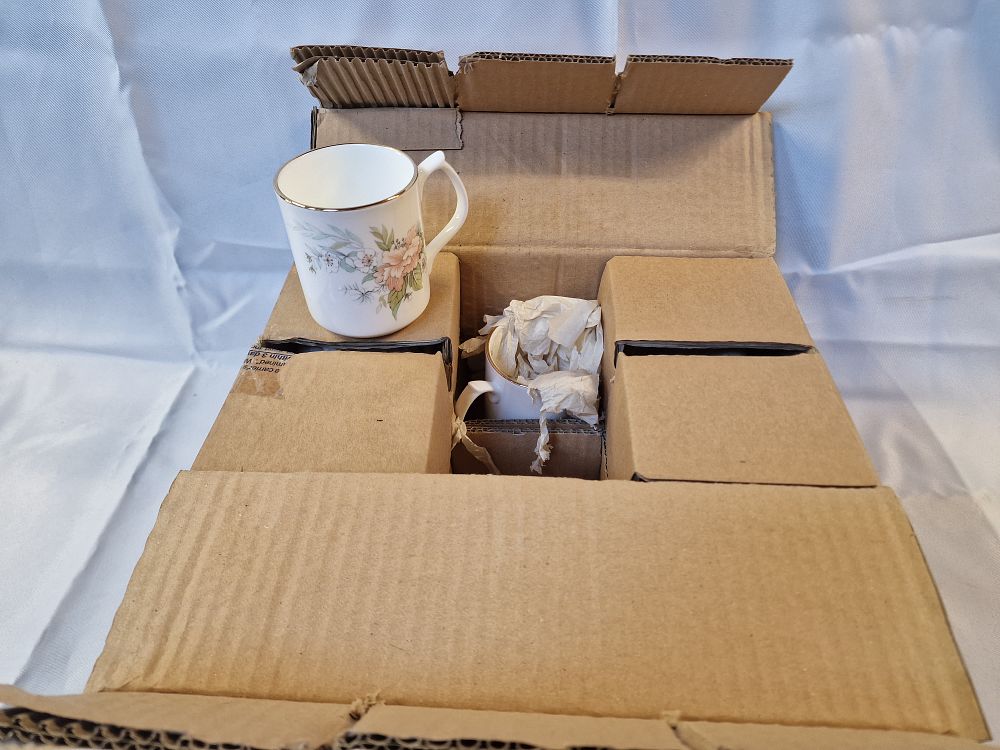 Lot 172: A set of six fine bone china floral decorated mugs