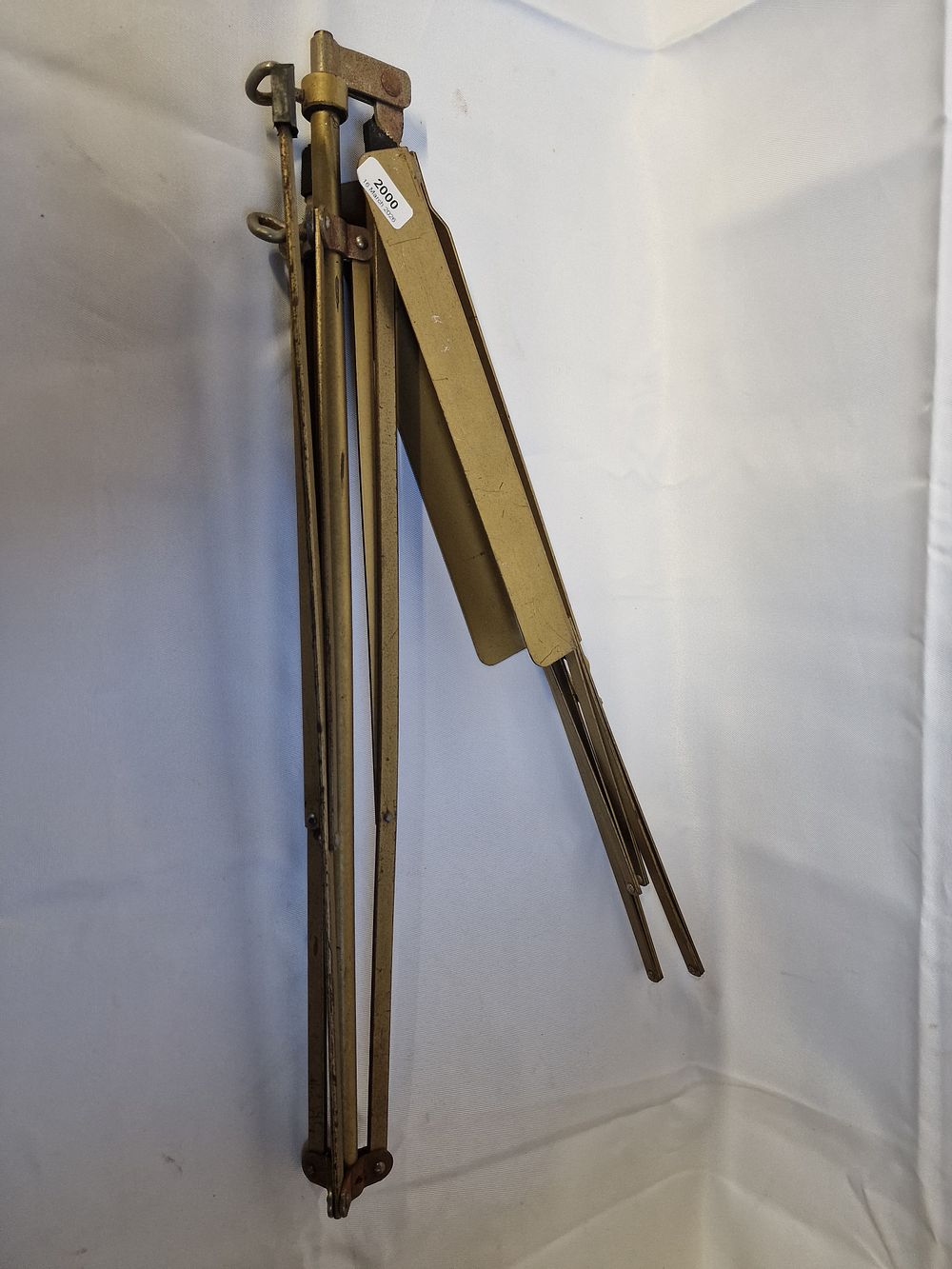 Lot 188: A vintage folding brass-toned metal tripod music stand
