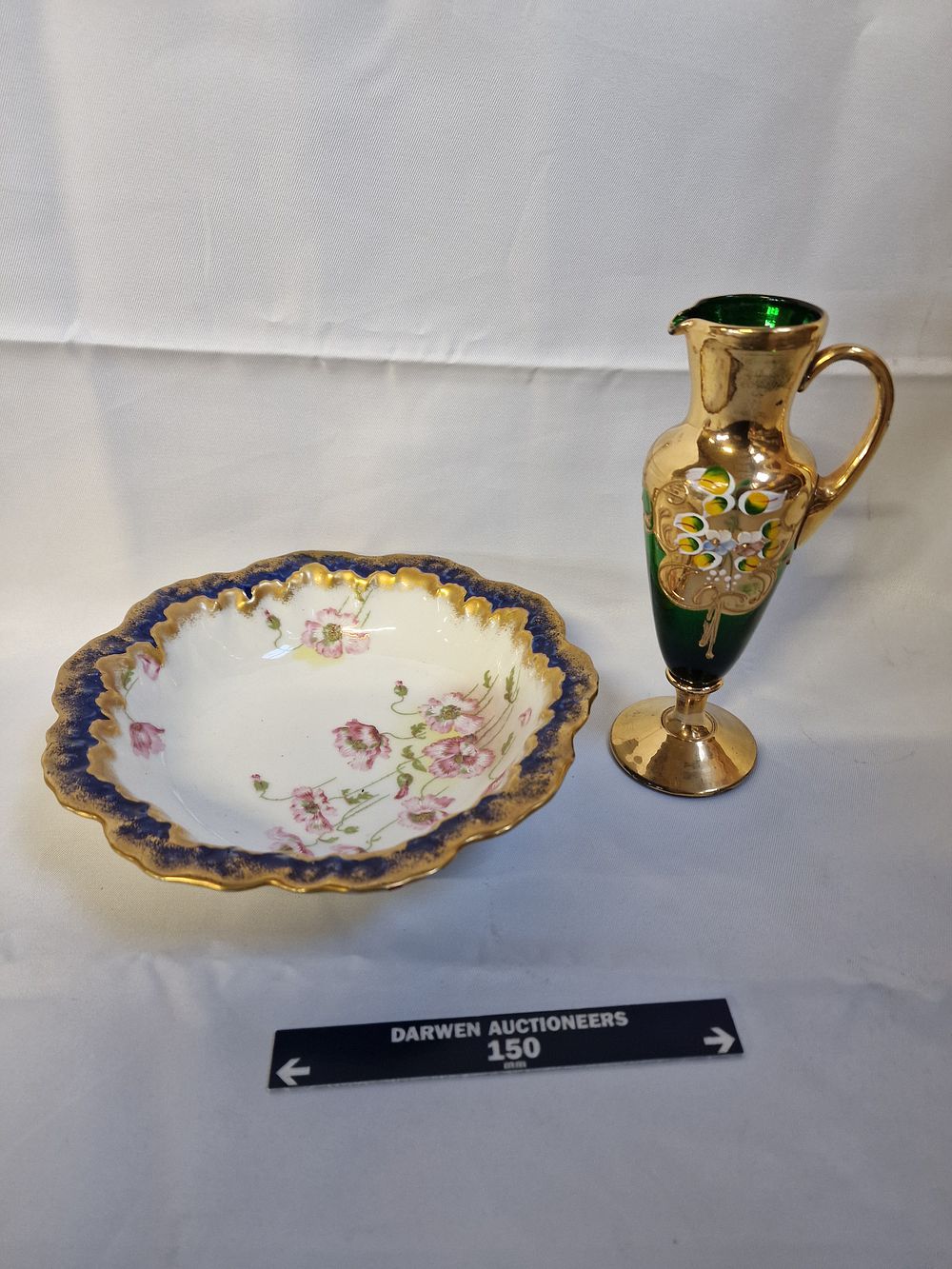 Lot 197: Two decorative items comprising an A. Lanternier porcelain bowl and a gilt-decorated glass ewer, circa 1900