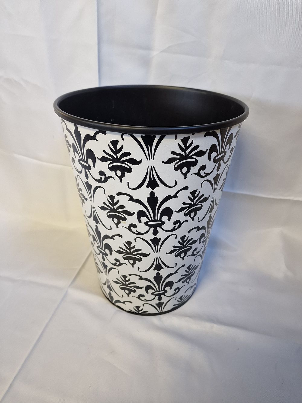 Lot 210: Tapered metal wastepaper bin with black and white damask pattern