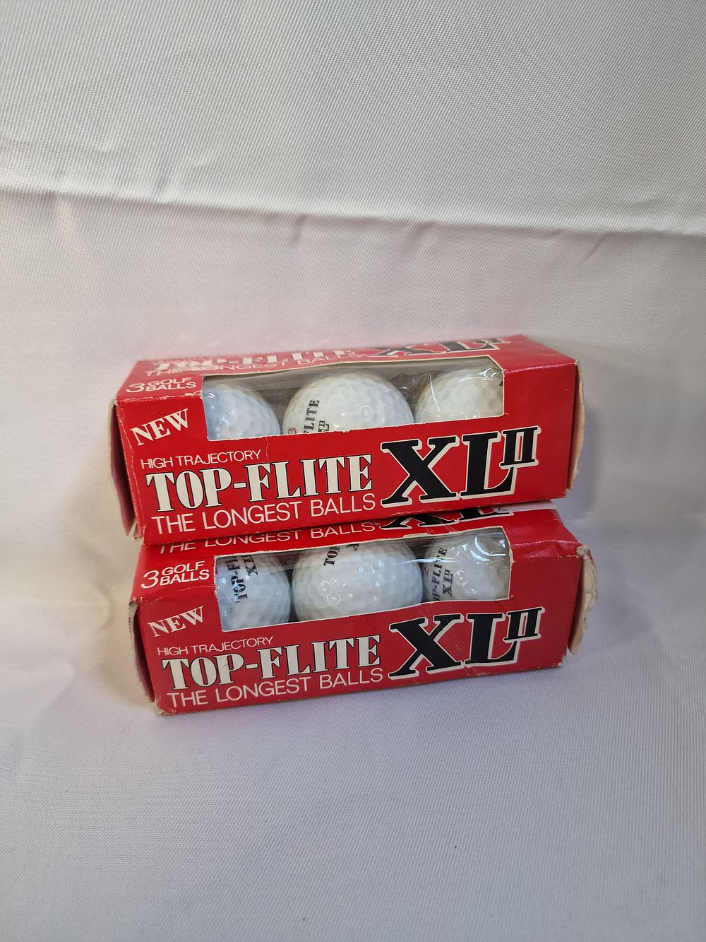 Lot 219: A Pair of Vintage Top-Flite XL II Golf Ball Sleeves