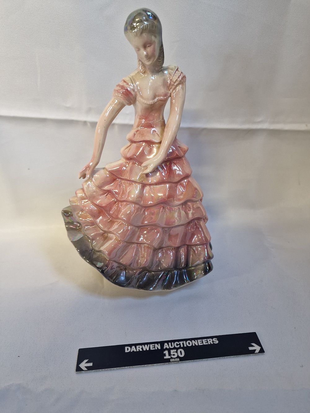 Lot 223: A Holland lustreware ceramic figurine of a crinoline lady
