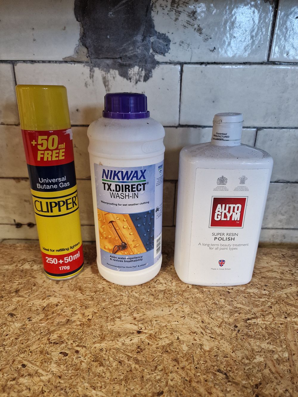 Lot 241: Three Assorted Maintenance Products Including Autoglym, Nikwax, and Clipper