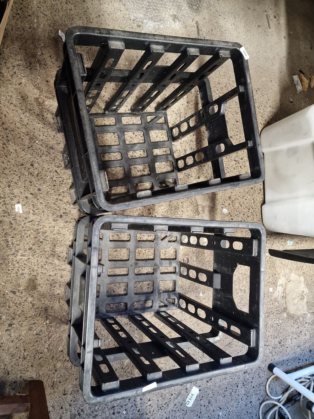 Lot 260: A Pair of Heavy-Duty Black Plastic Milk Crates