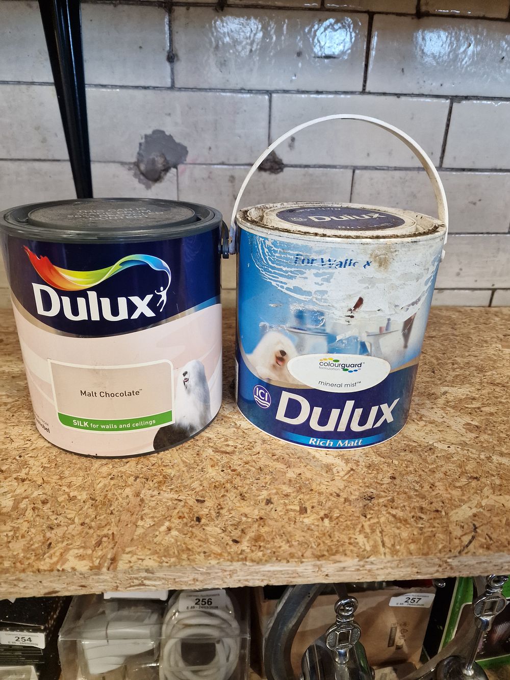 Lot 284: A Pair of Dulux Interior Paint Cans in Mineral Mist and Malt Chocolate