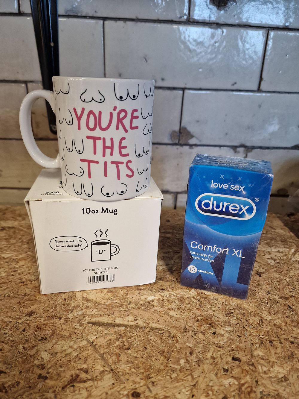 Lot 298: Two contemporary novelty items comprising a ceramic mug and Durex condoms