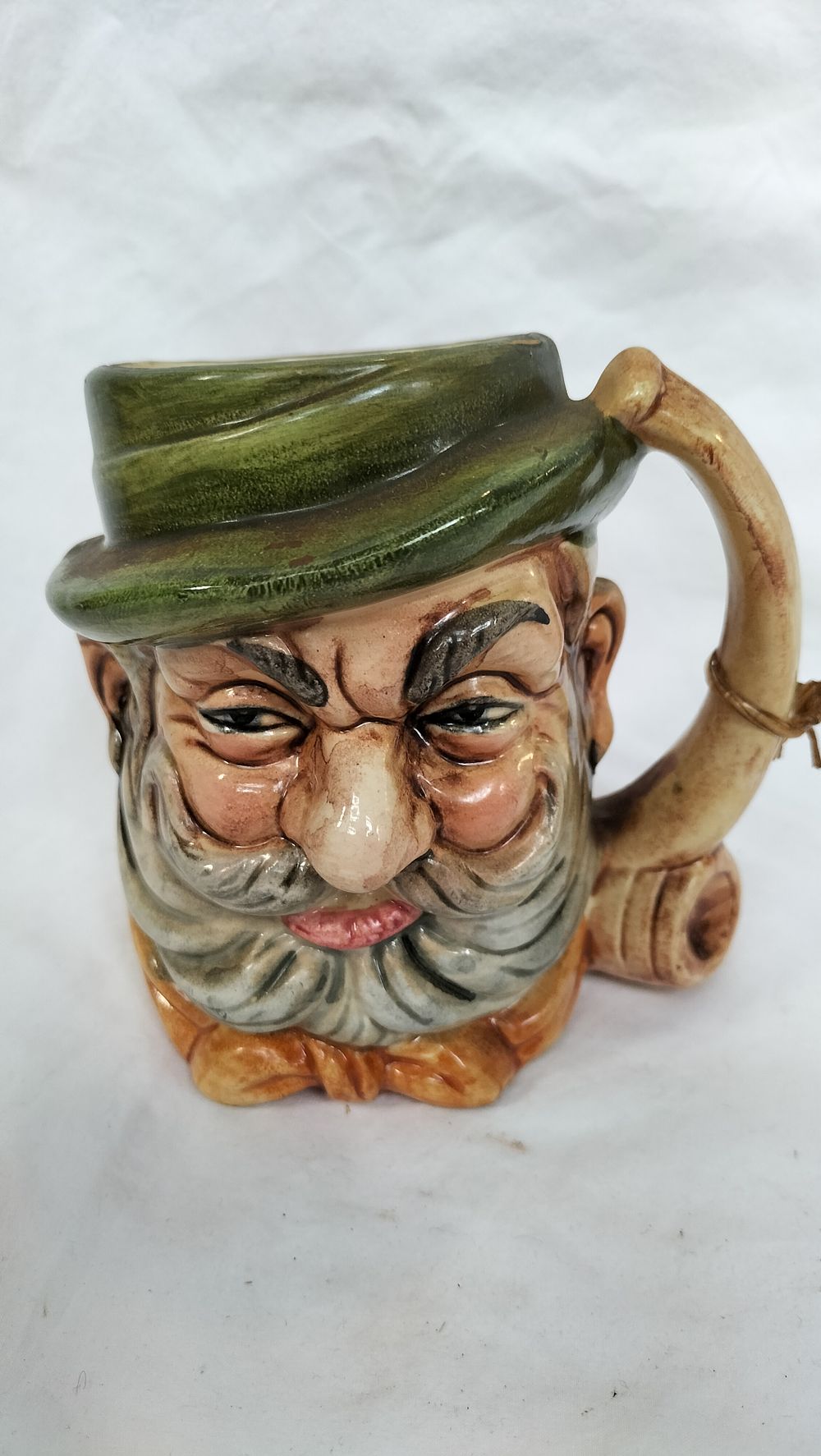 Lot 256: A Glazed Pottery Character Jug in the Style of Royal Doulton