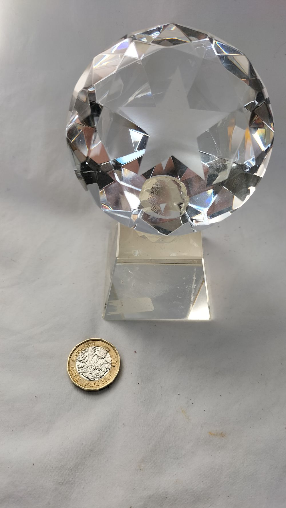 Lot 276: A Faceted Glass Diamond-Form Paperweight Award with Star Motif