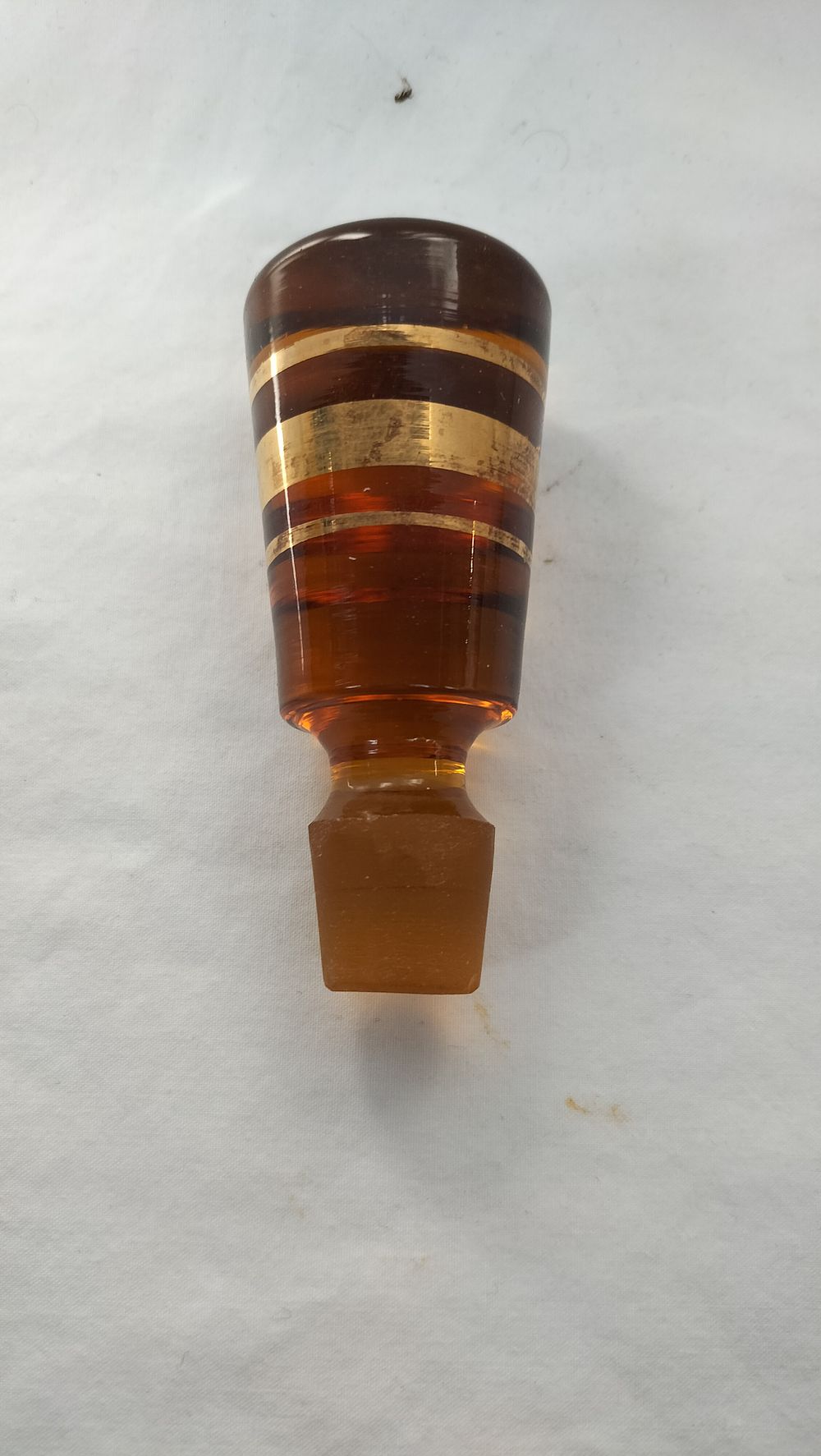 Lot 286: Mid-20th Century Amber Glass Scent Bottle Stopper with Gilt Banding