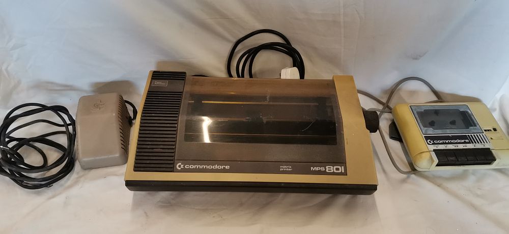 Lot 181: A Trio of Commodore Computer Peripherals including MPS 801 Printer, C2N Cassette Drive, and Power Supply