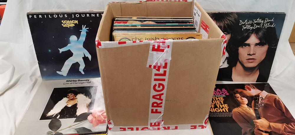 Lot 221: A Collection of Approximately 25-30 Vinyl LP Records Including Rock, Pop, and Folk