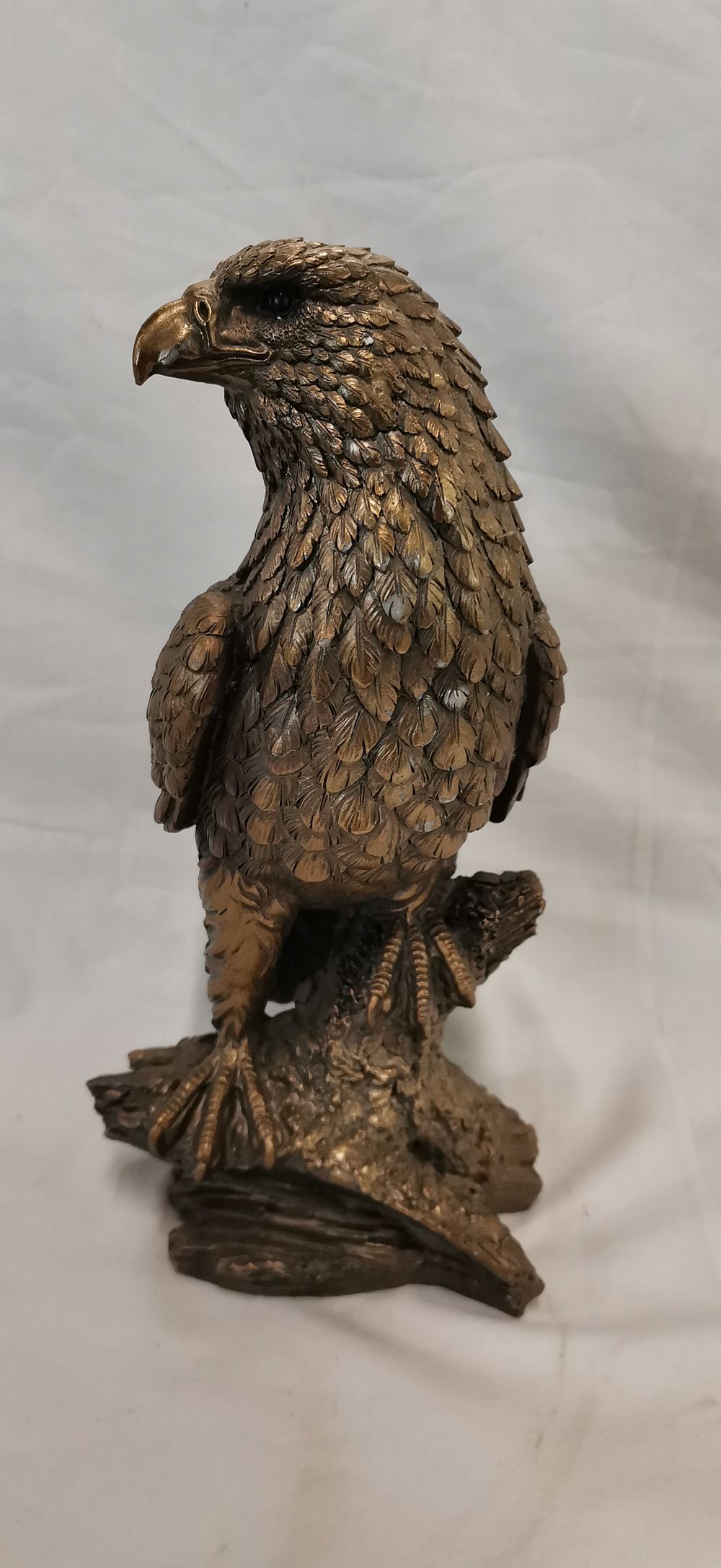 Lot 233: A cold cast bronze resin sculpture of a perching eagle