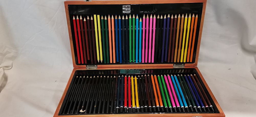 Lot 239: An Assortment of Coloured and Graphite Pencils in a Wooden Case