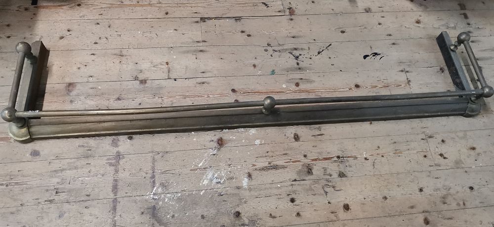 Lot 279: A Late Victorian or Edwardian Style Brass and Iron Fire Fender. COLLECTION ONLY