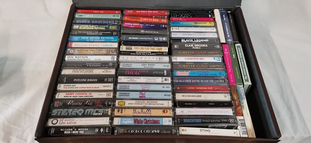 Lot 284: A Collection of Approximately 60 Audio Cassette Tapes in a Textured Vinyl Carrying Case