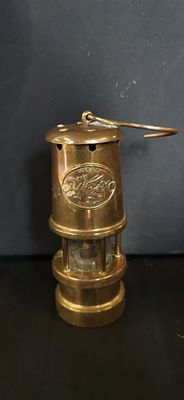 A Phoenix Supply Miniature Brass Welsh Miners Safety Lamp. A miniature decorative miners safety 