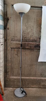 A contemporary silver-toned metal uplighter floor lamp. COLLECTION ONLY. A contemporary 