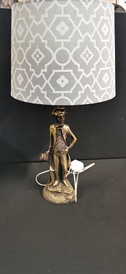 A figurative table lamp depicting a naval officer in the style of Admiral Lord Nelson. A 