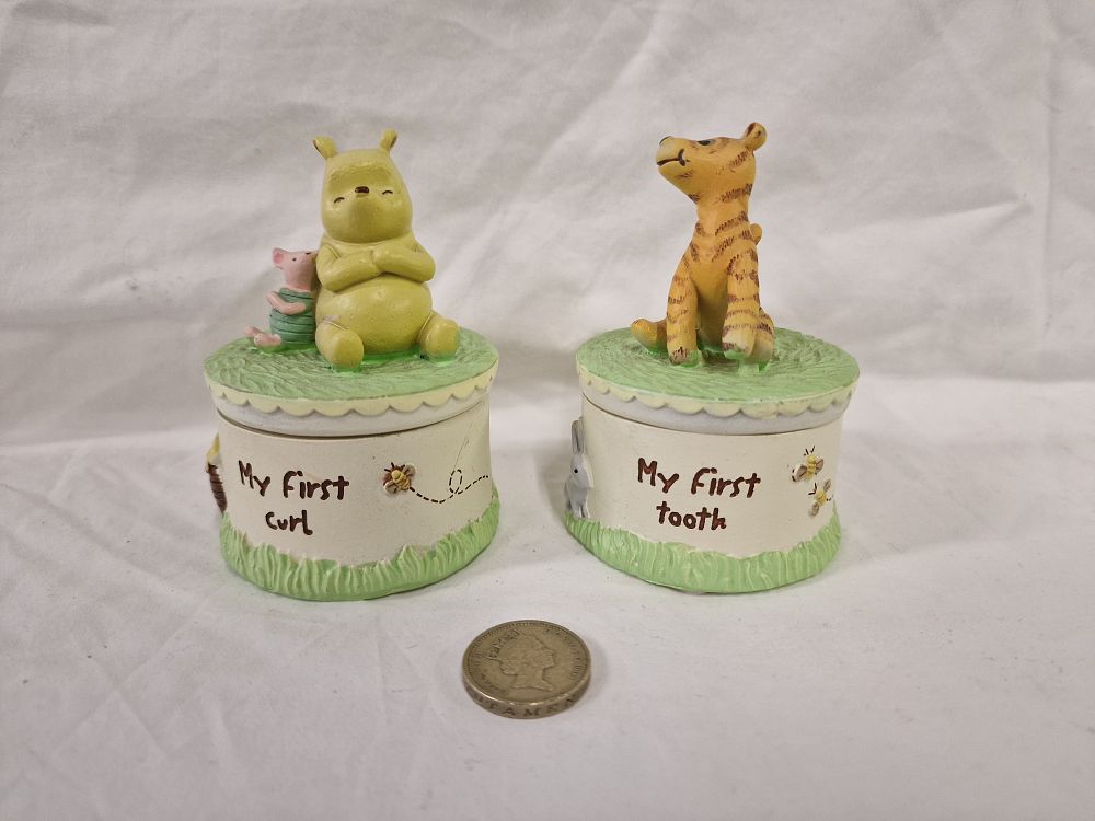 Lot 409: A Pair of Disney Winnie the Pooh Resin Tooth and Curl Trinket Boxes