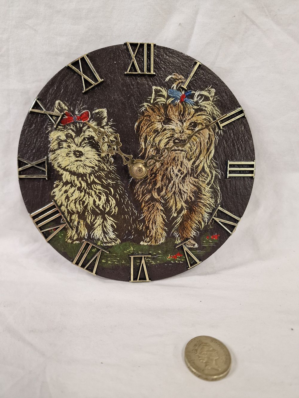 Lot 452: A circular wall clock dial featuring Yorkshire Terriers