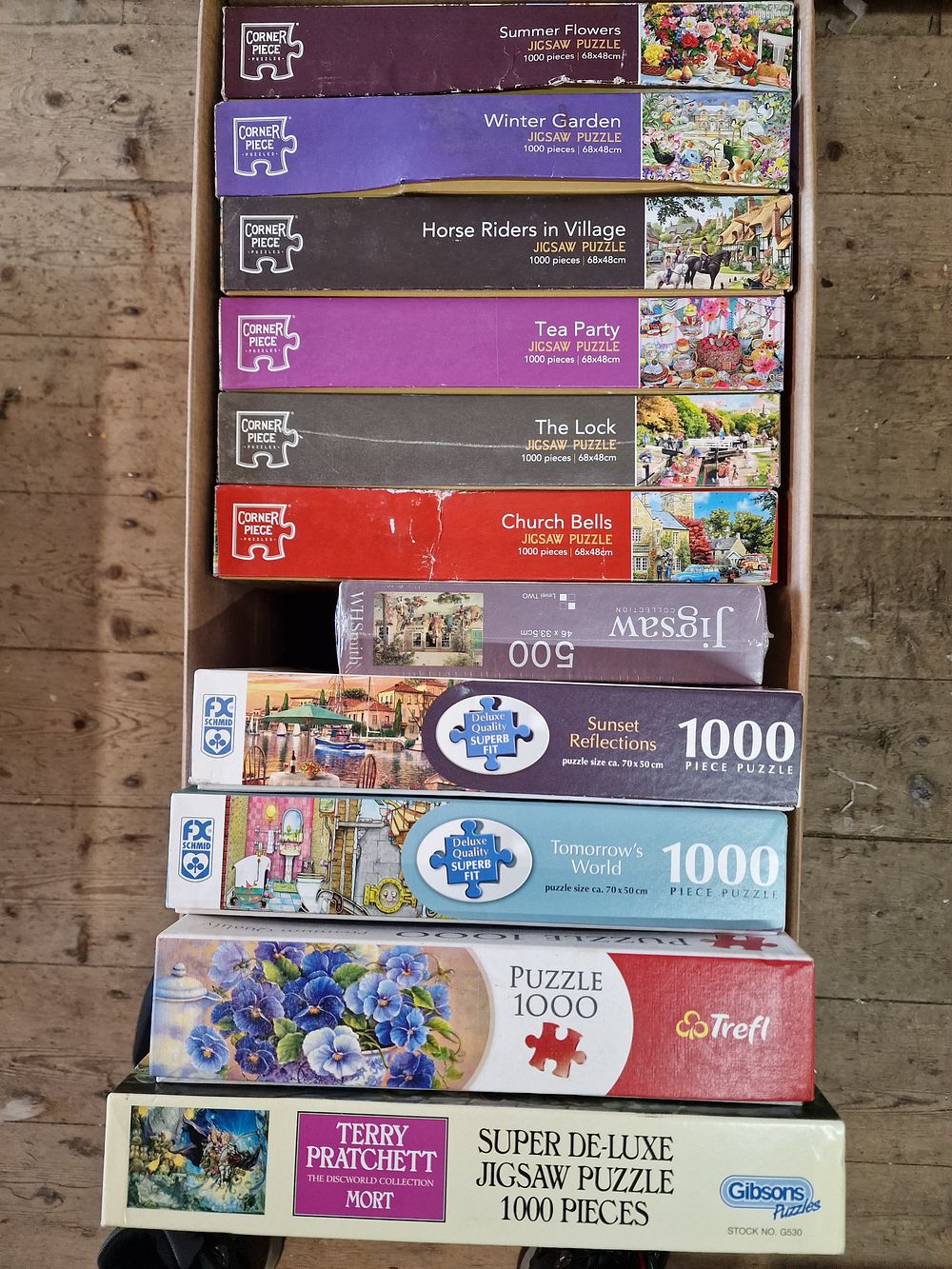 Lot 519: A Collection of Eleven Boxed Jigsaw Puzzles Including Gibsons Discworld and FX Schmid